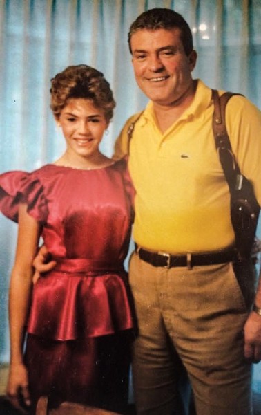 Former FBI agent Tom Burgoyne poses with his daughter Erin before she attended a formal dance in the late-1980s. Erin did report that Tom removed his firearm before answering the door when her date arrived.