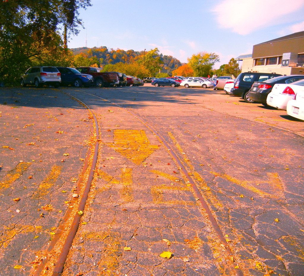 Parking lot along South St.; Wesbanco Arena top right, railroad tracks still embedded. (Photo - Rich Knoblich)