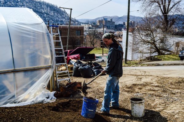 Danny Swan works to prepare top soil for the initiation of this year's growing season at Grow Ohio Valley's new greenhouse complex in East Wheeling.