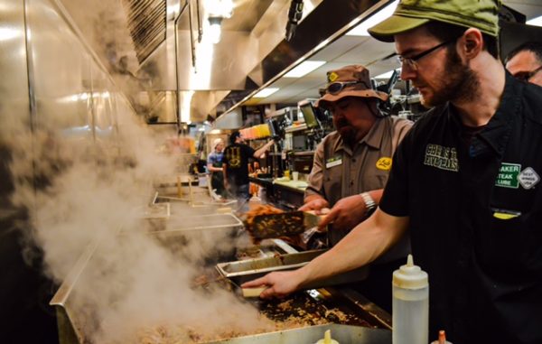Ozzie Hyde, Quaker Steak GM, worked the line to help put the final touches on the pulled pork.