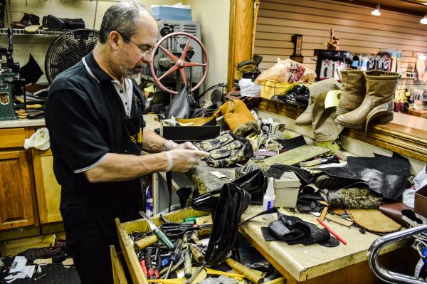 Campeti repairs between 50 and 100 pairs of shoes each week.