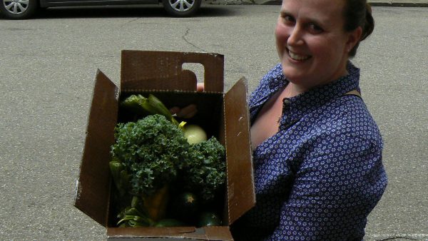 Wheeling resident Hope Coffield was anxious to pick up her box of locally grown foods as a subscriber of the Community Supported Agriculture program.