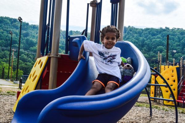 Two-year-old Jackie Byrd enjoys one of the slides at the new Elks Playground in East Wheeling.