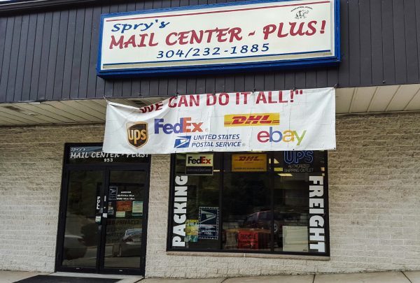 Spry's Mail Center Plus is located in the Woodsdale Plaza near Pappa John's and Subway.