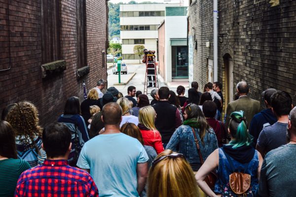 Nearly 100 local residents attended Bennett McKinley's final "Meet Me in the Alley" photo shoot in downtown Wheeling.