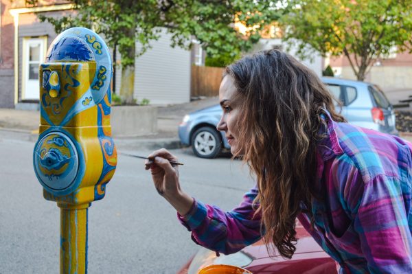 Wheeling artist Patricia Croft works on her parking meter on the east side of Centre Market.