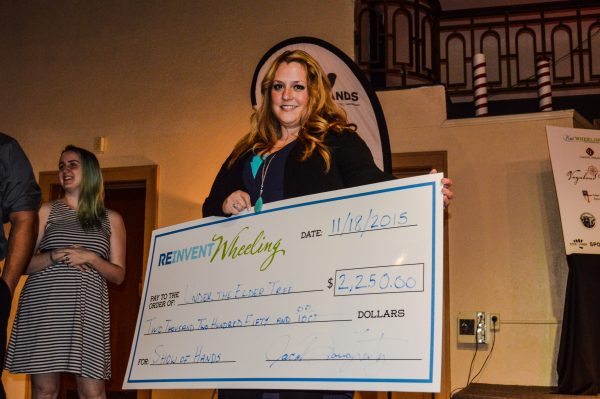 Carrie Eller was presented the "big check" Wednesday night at the Capitol Ballroom.
