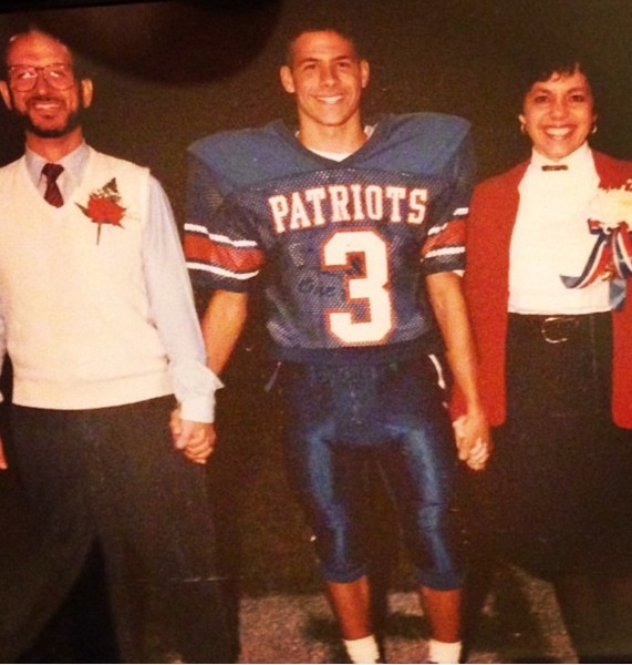 Matt DiLorenzo during his Wheeling Park football days, posing with his parents