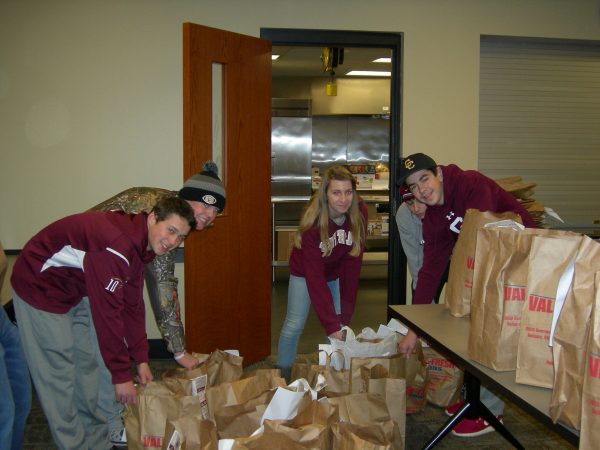 More than 20,000 food items were donated last year and Robert Kahle, Clayton McCabe, Emily Emmerth, and Matt Turziano were a few of the students to put in the hard work at the 18th Street Neighborhood Center.