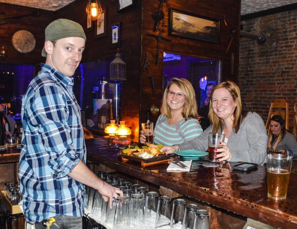 Barkeep Brenden Cupp and customers Abbey Bennett and Caroline McCabe, both of whom are residents of Martins Ferry, Ohio. 