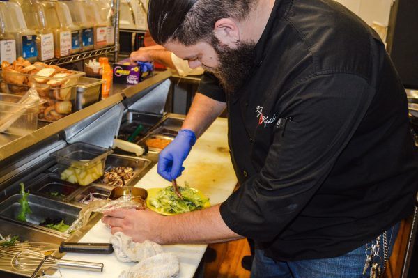 The "Vagabond Chef" Matt Welsch prepares a Caesar Salad complete with anchovies.