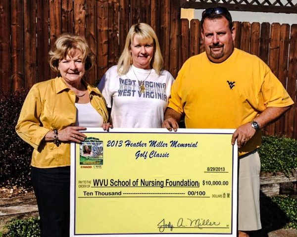 Jody Miller (middle) and her husband Gary created the Heather Miller Memorial Golf Classic to raise scholarship dollars for nursing students at WVU. 