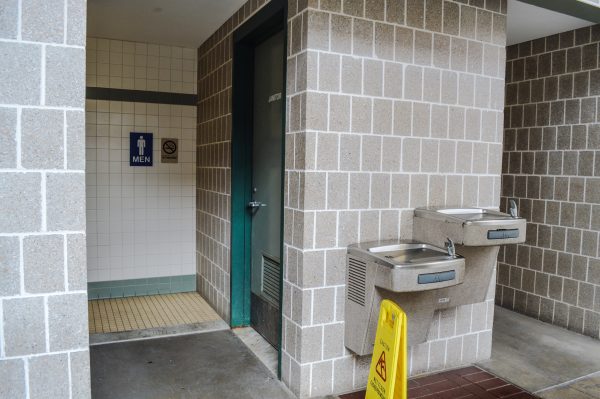 The empty portion of the garage's street level is equipped with restrooms.