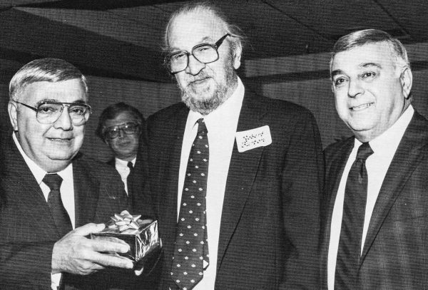 Robert O. Burton (center) designed Elby's restaurants for 14 years and when he retired George and Mike Boury presented him with a special gift.