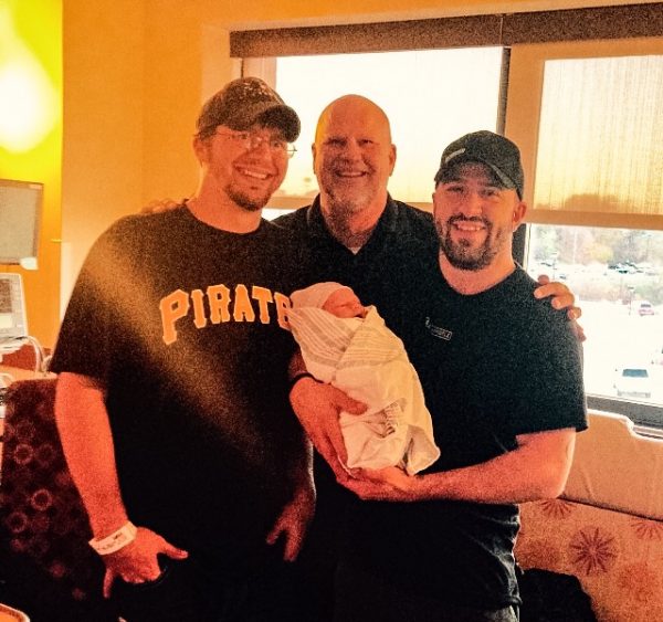 Palmer's son, Cory and Eric, visit with Cory's son, Noah. The new addition came along on Nov. 4, 2015.