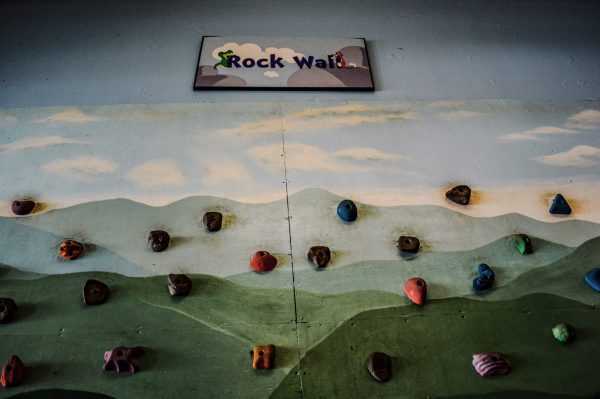 The climbing wall is a popular attraction at the museum.