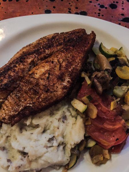 Cajun catfish, sauteed vegetables, and mashed red potatoes is a favorite plate at the Wheeling Brewing Company.