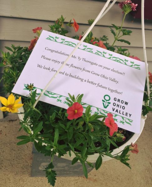 Officials of Grow Ohio Valley offered flower baskets to each of the winners in Wheeling's elections.
