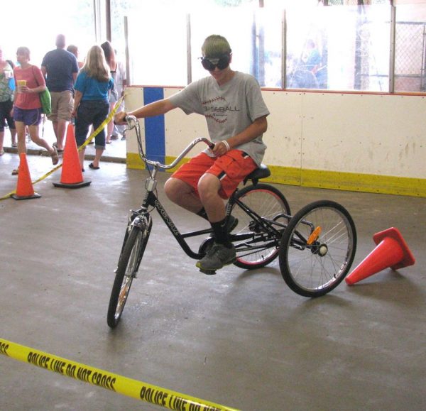 Even operating a three-wheeler is difficult when wearing the "drunk goggles" made available by local law enforcement.
