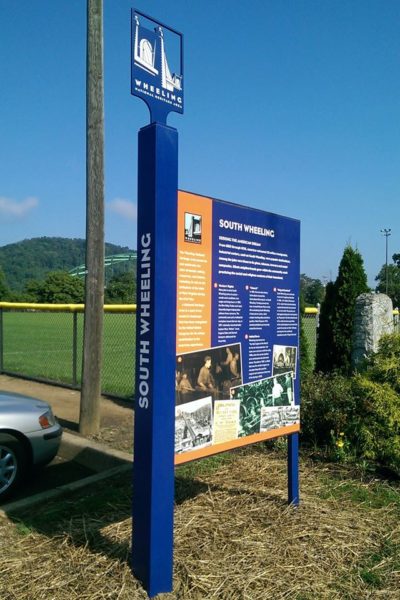 Interpretive signage created by Wheeling National Heritage Area tells neighborhood history of industry and labor.
