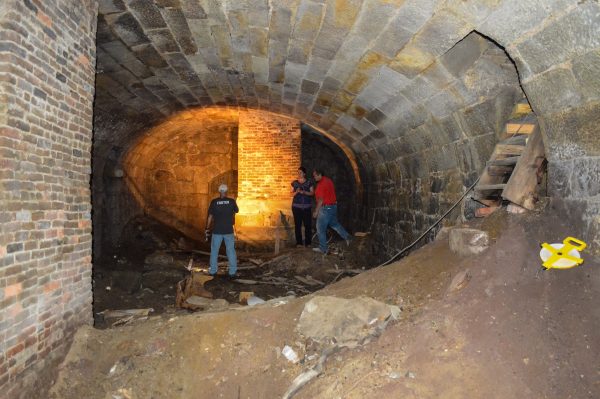 Wheeling Heritage historian Rebekah Karelis examines the cellar that's located beneath an apartment complex on the north end of Wheeling Island.