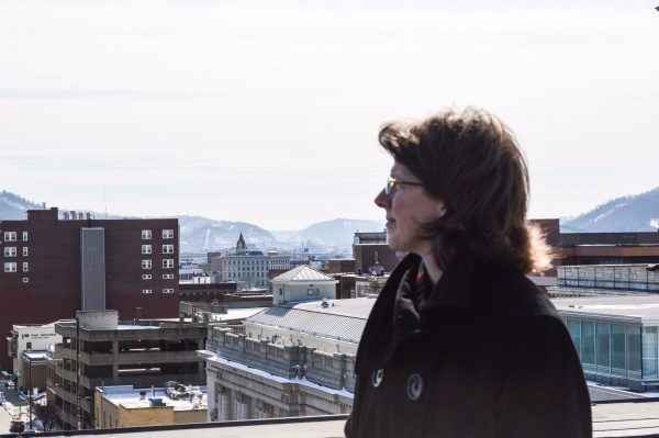 Ward 4 Councilwoman Wendy Scatterday looks over the Friendly City's downtown district from atop the Wheeling YWCA building on Chapline Street.
