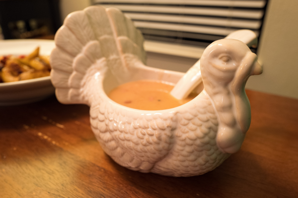 Homemade gravy served in a turkey-shaped dish.