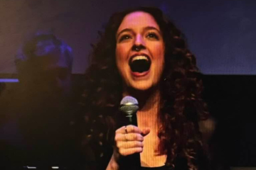 Amanda McGovern Wheeling performing at NextGen singing competition