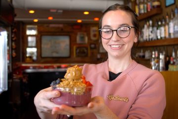 Sami of LaBowls showing off an acai bowl creation.